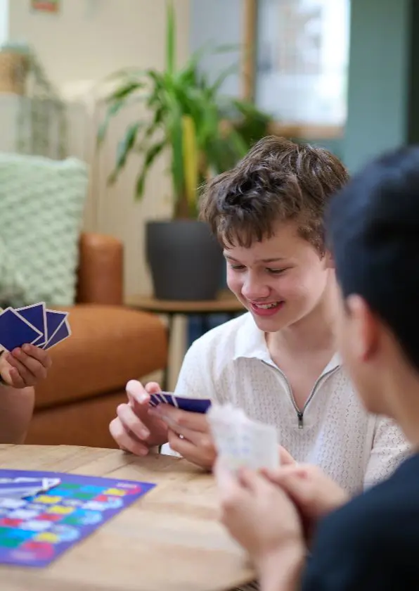 Boys playing boardgame