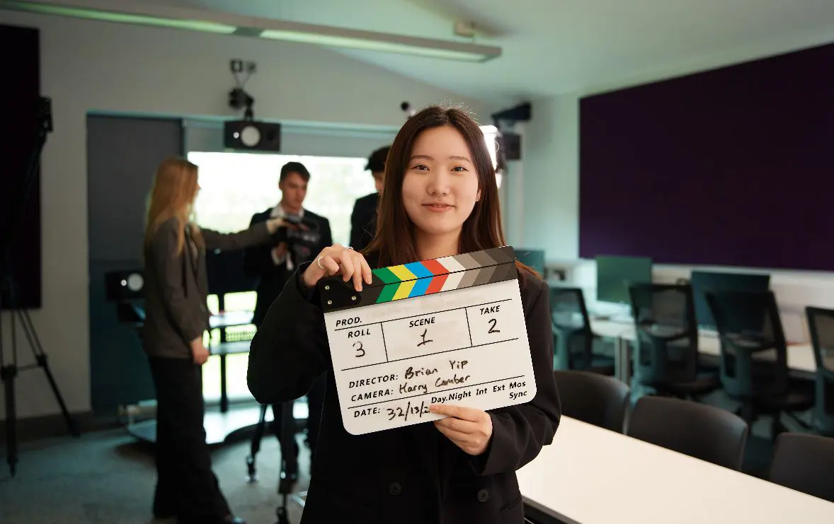 Student filming on set