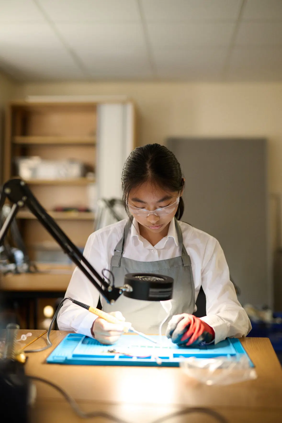 Female student focused on DT work