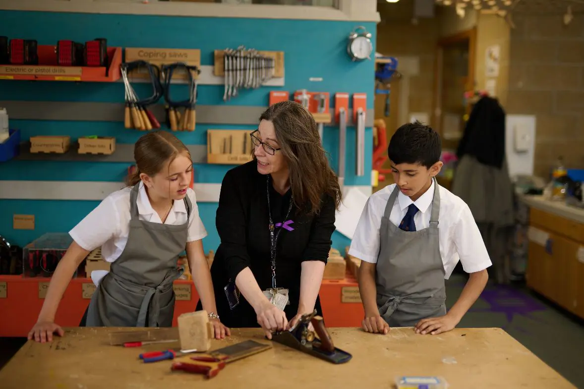 Teacher with two students 