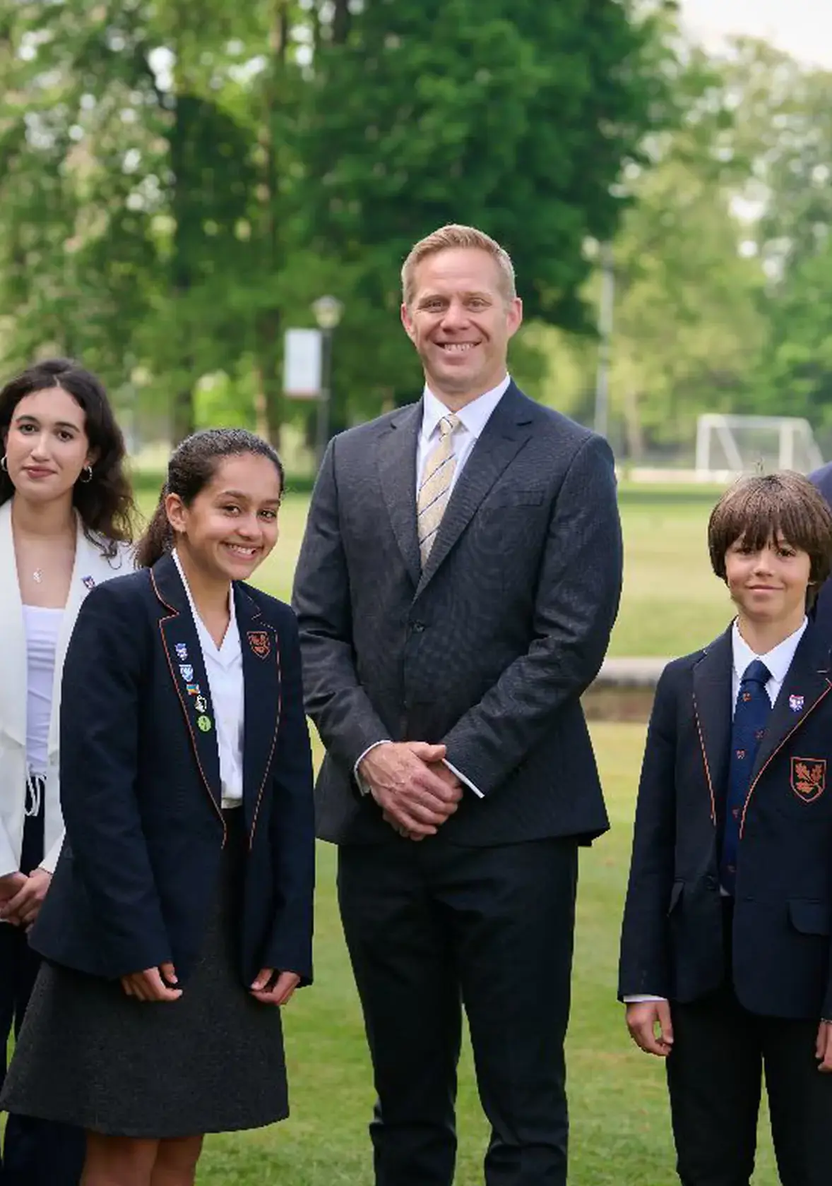 Teacher standing with students