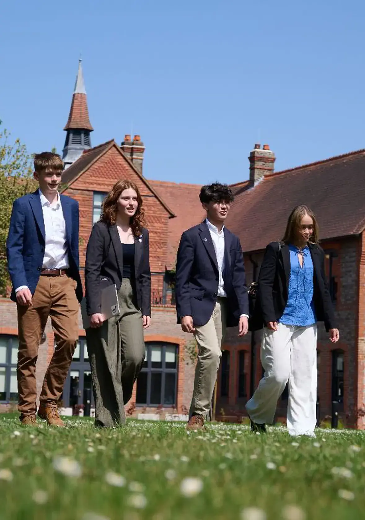 Students walking on school lawn