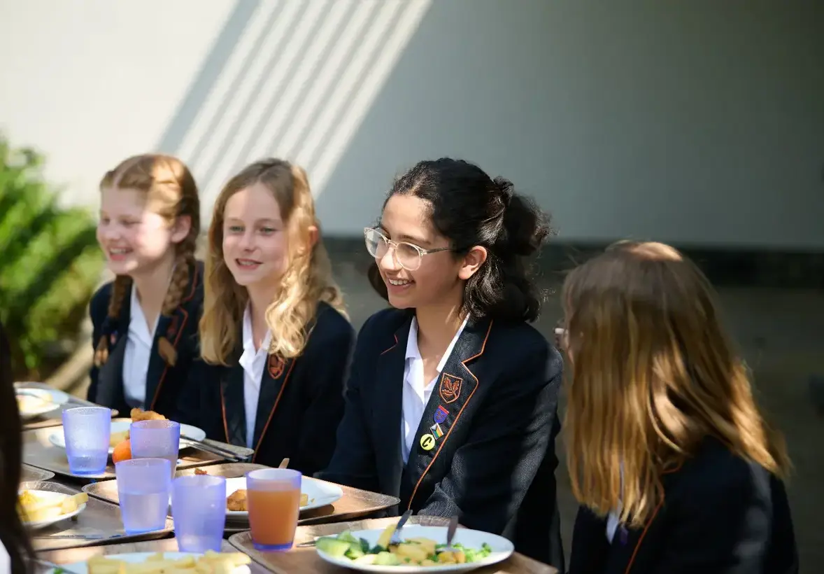 Girls sat at lunch