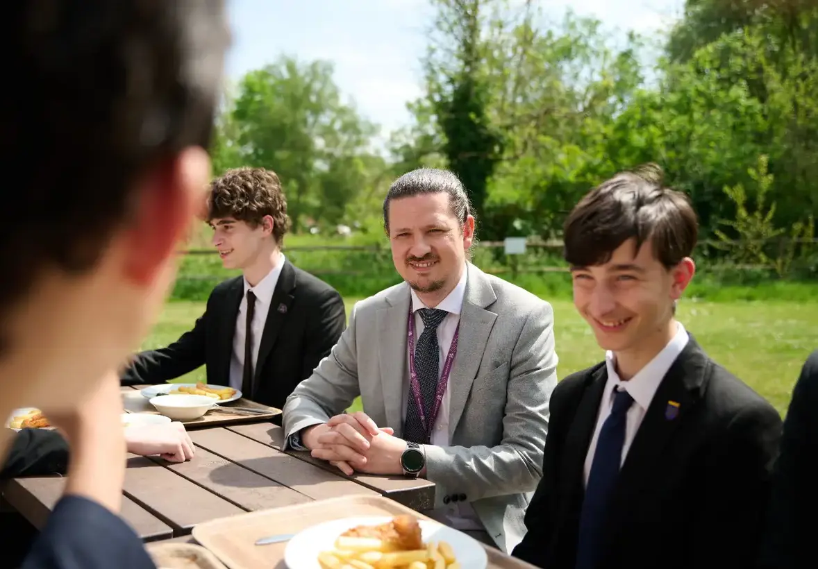 Teacher with students outdoors