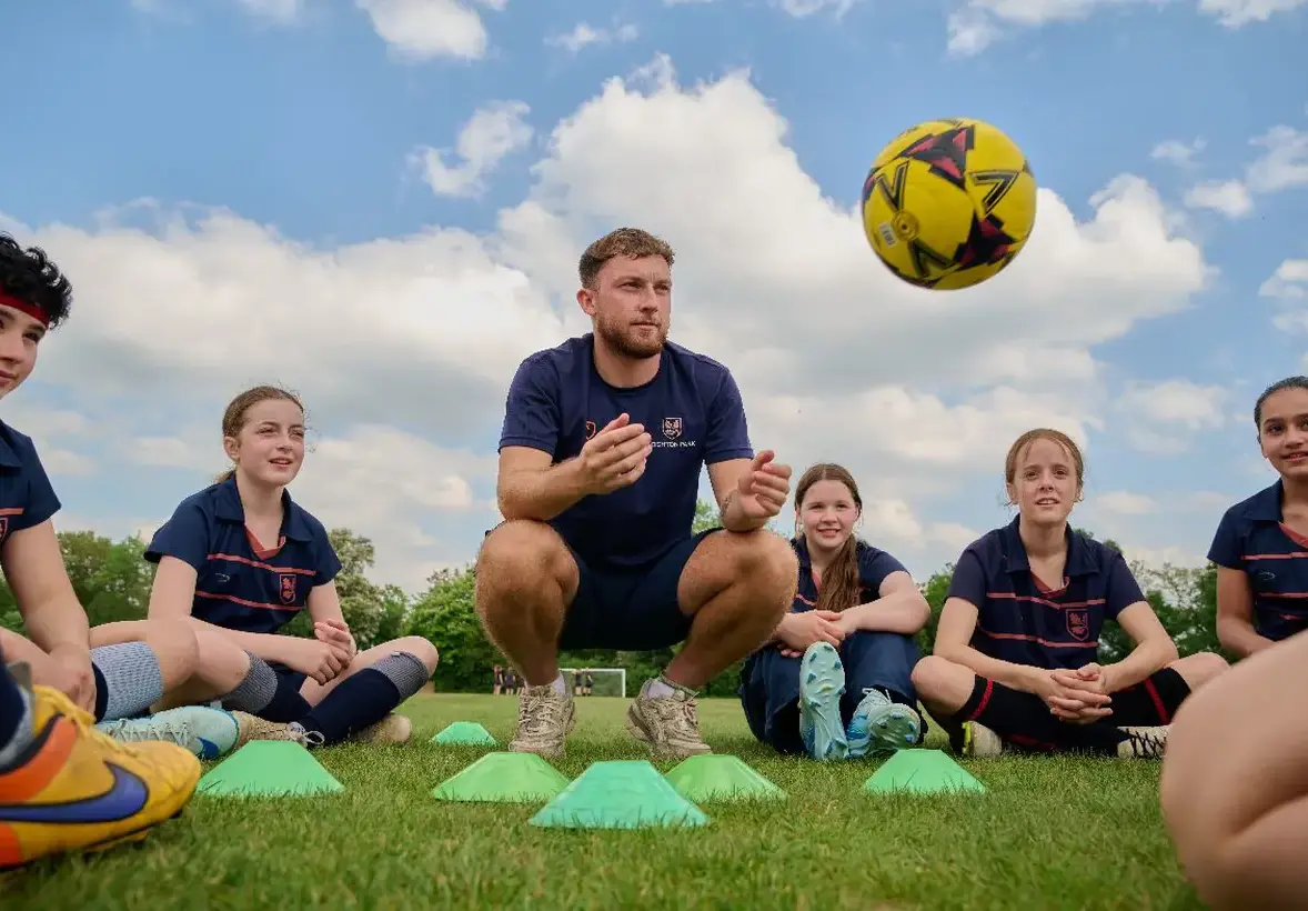 Sports teacher with students