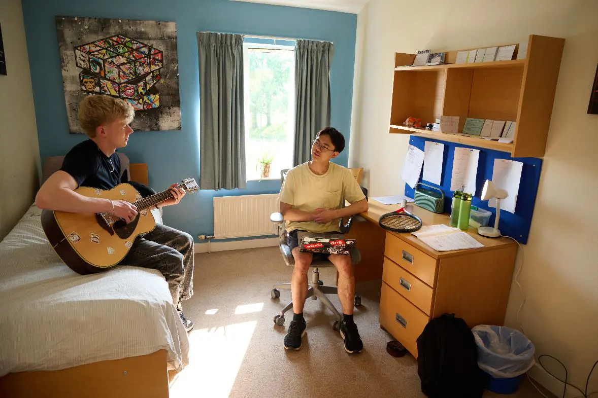 Two male students hanging out in rooms