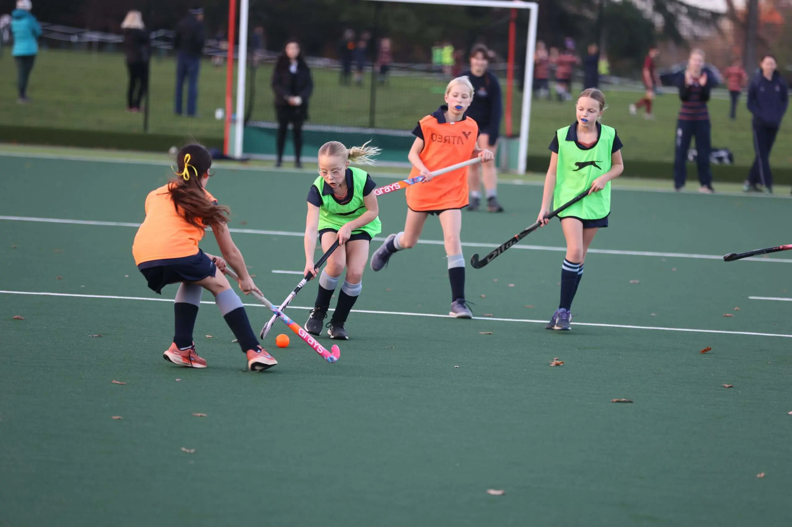 Girls playing hockey on Astro - Leighton Park School