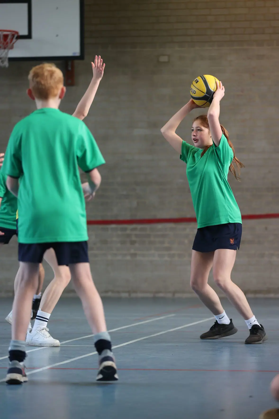 Students playing basketball