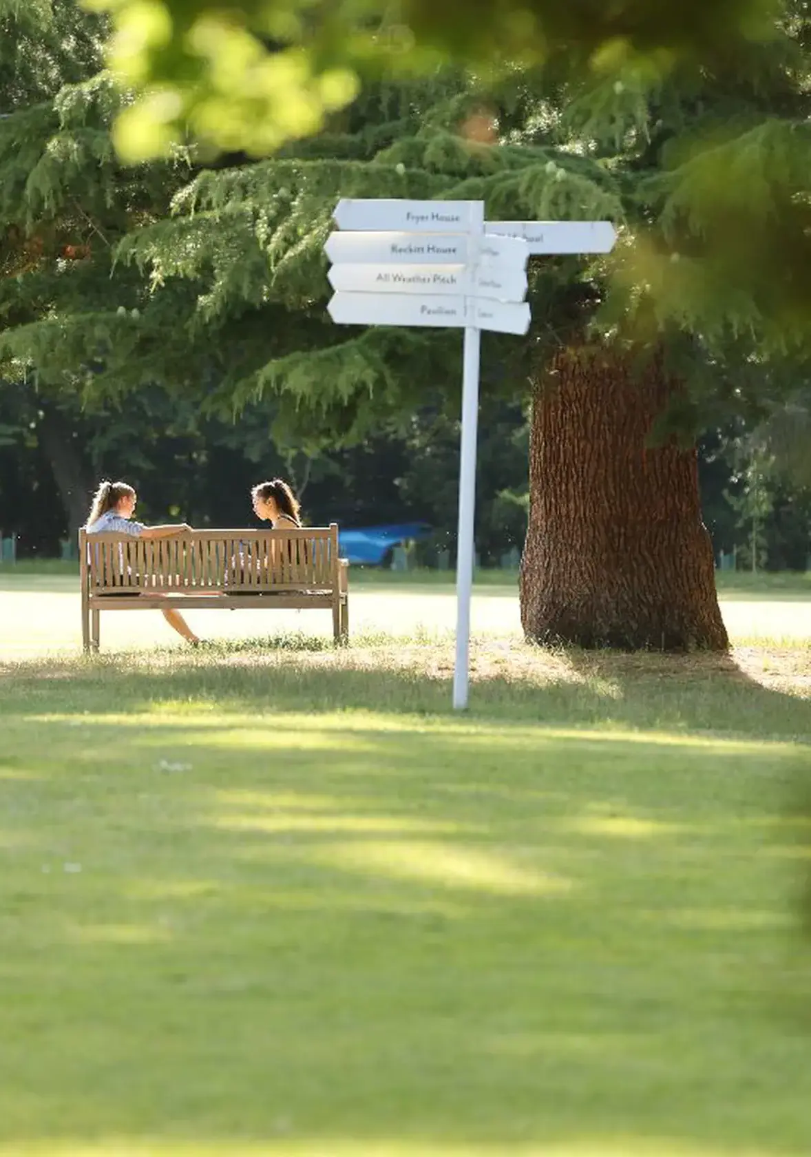 Students sat on bench outside