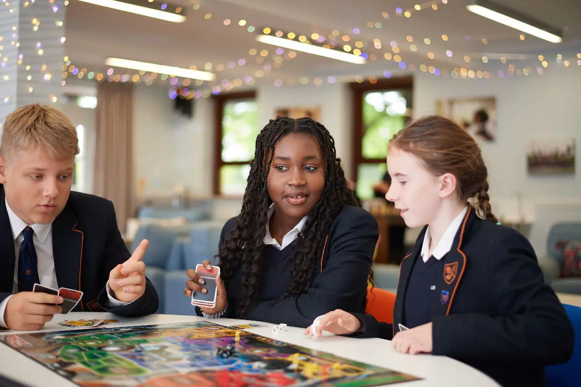 students playing with boardgame